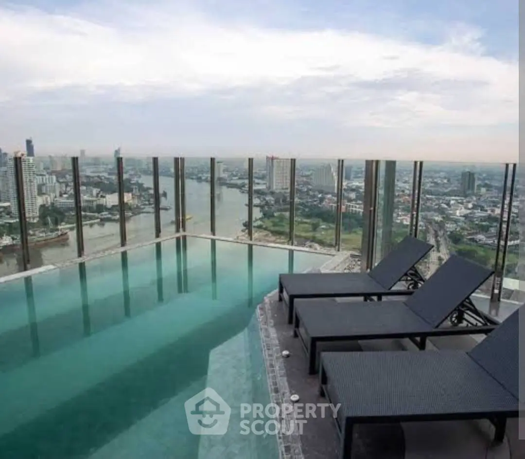 Stunning rooftop pool with panoramic city views and luxurious lounge chairs.