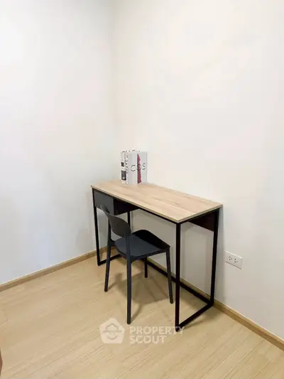 Minimalist study area with sleek desk and chair in modern apartment