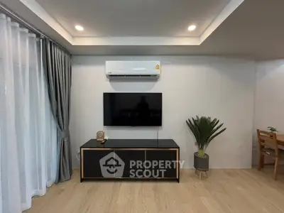 Modern living room with sleek TV setup and stylish decor