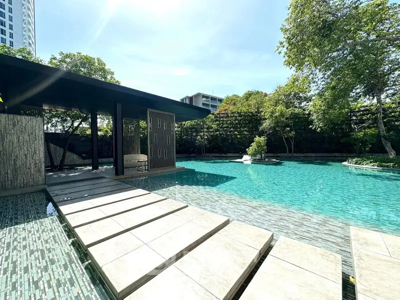 Luxurious poolside view with modern design and lush greenery