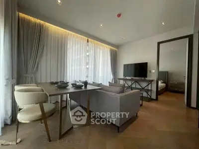 Modern living room with elegant dining area and natural light