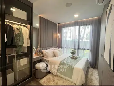Luxurious bedroom with elegant decor and large window for natural light