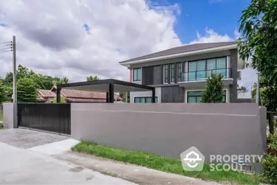 Modern two-story house with sleek design and spacious driveway in a serene neighborhood.