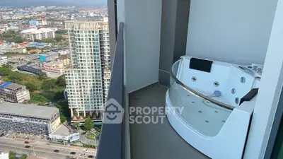 Luxurious high-rise balcony with private jacuzzi and stunning city view