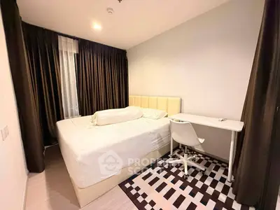 Cozy bedroom with modern decor, featuring a comfortable bed and study desk, ideal for relaxation and productivity.