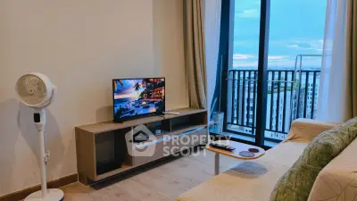 Modern living room with balcony view, stylish furniture, and entertainment setup in high-rise apartment.