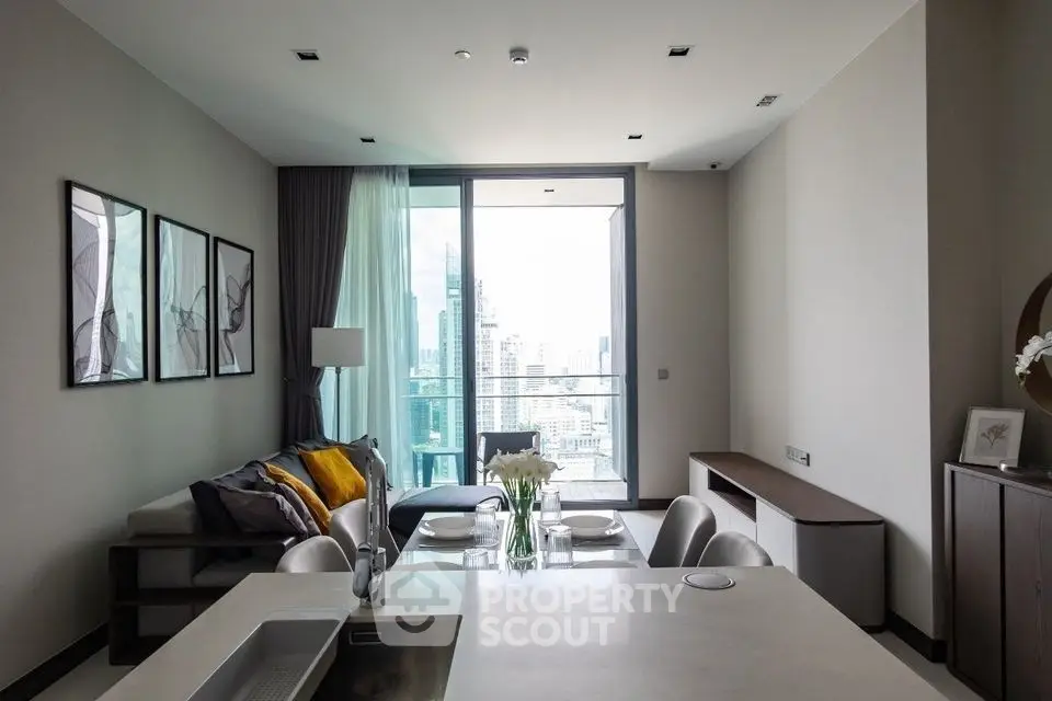 Modern living room with city view, stylish decor, and open layout in luxury apartment.