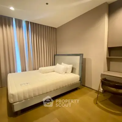 Modern bedroom with stylish decor and natural light