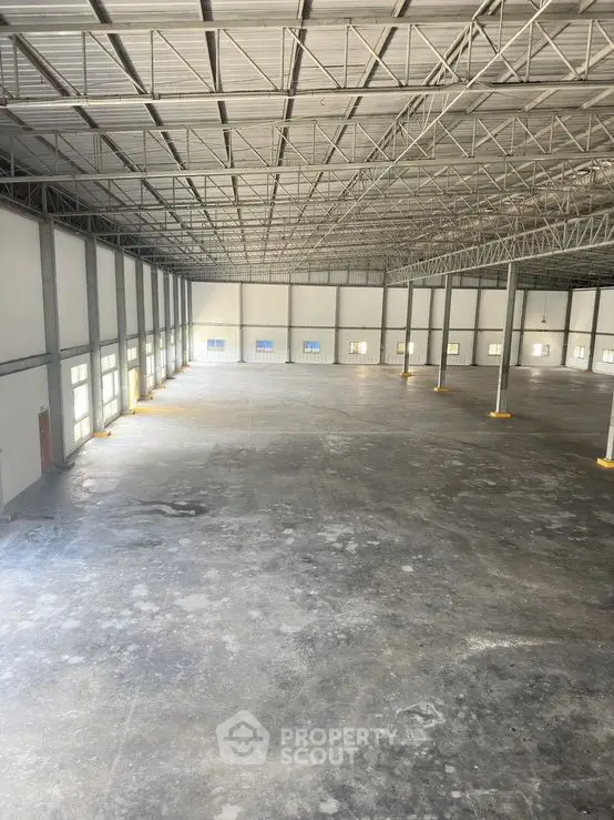 Spacious industrial warehouse with high ceilings and ample natural light