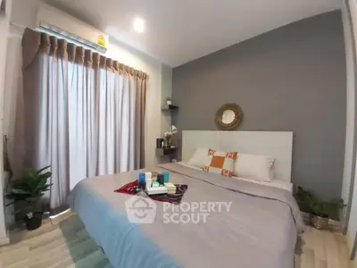 Cozy modern bedroom with stylish decor and natural light