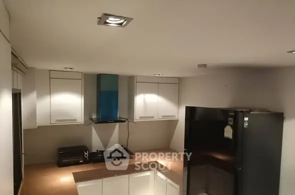 Modern kitchen with sleek cabinets and gas stove