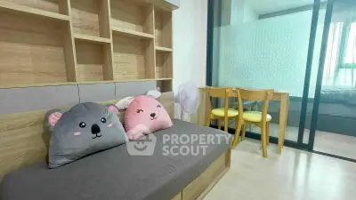 Charming living room with cozy seating and playful decor in modern apartment.