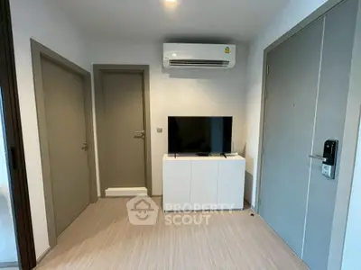 Modern interior with TV and air conditioning in a compact living space.