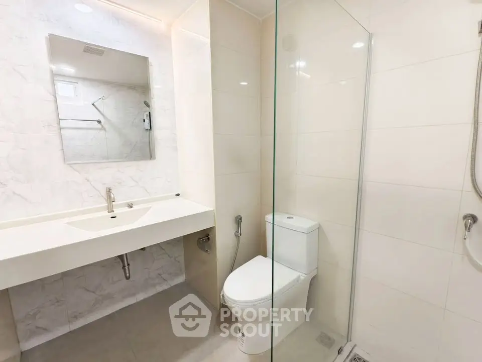 Modern bathroom with sleek design and glass shower enclosure