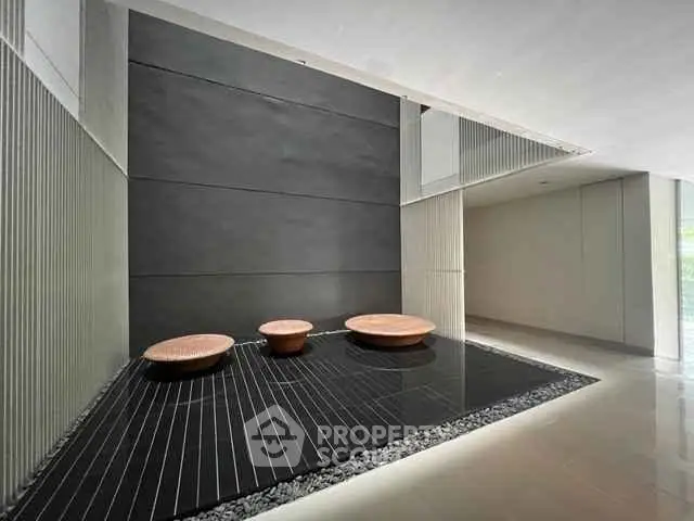 Modern building entrance with sleek design and stylish decor elements.