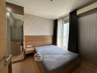 Modern bedroom with wooden accents and natural light in a stylish apartment.