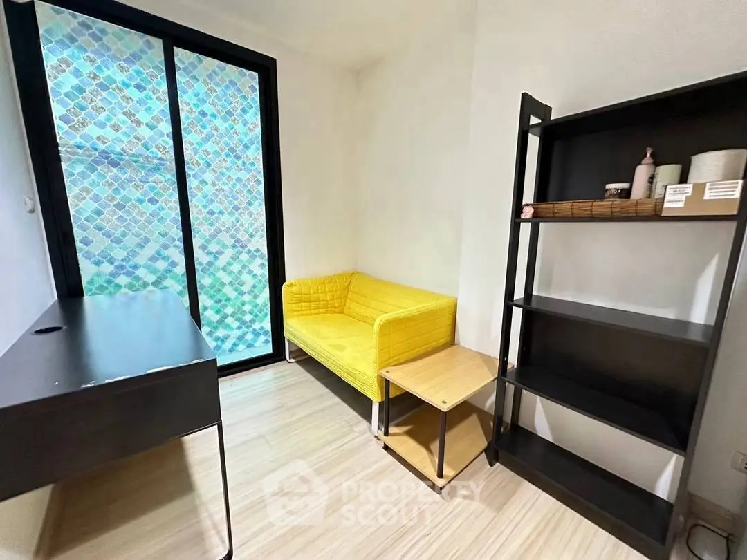 Cozy study room with yellow sofa and modern black desk