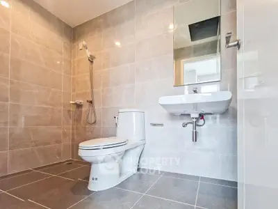 Modern bathroom with sleek fixtures and spacious layout in contemporary home.