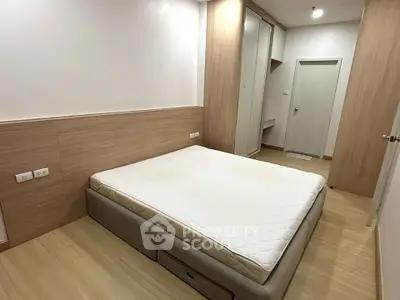 Spacious bedroom with modern design and ample storage space