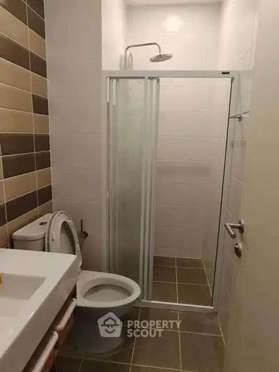 Modern bathroom with sleek shower and contemporary tiles