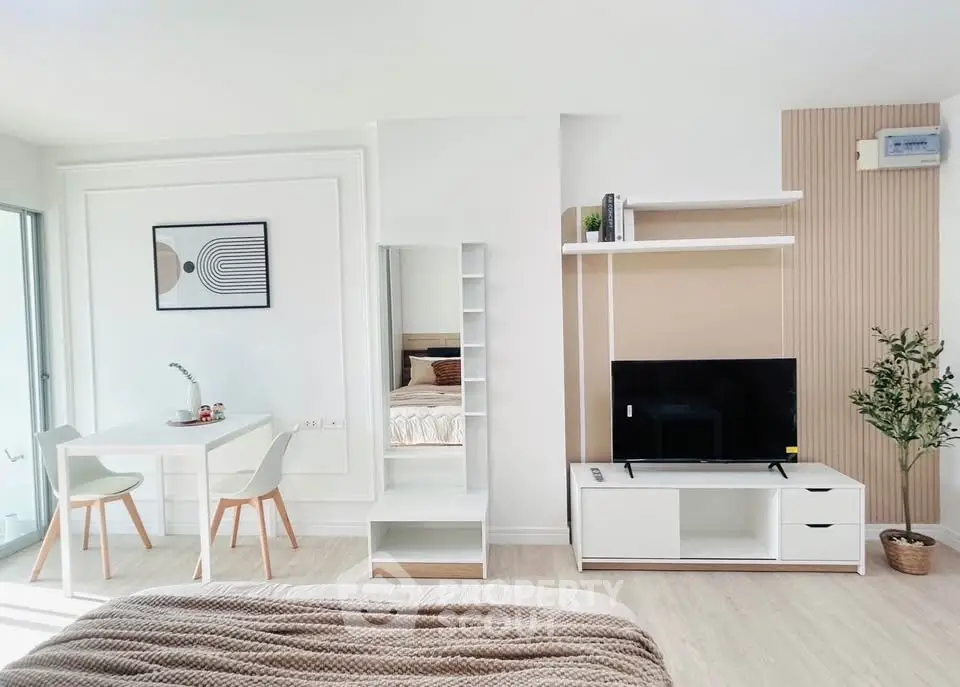 Modern open-plan living room with stylish decor and natural light