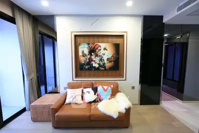 Stylish modern living room with leather sofa and artistic wall decor