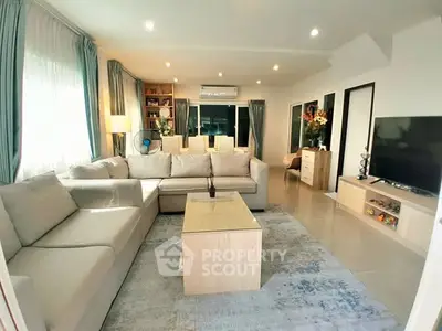 Spacious modern living room with elegant decor and ample natural light