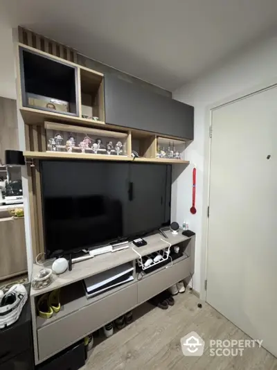 Modern living room with sleek TV unit and stylish shelving