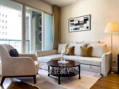 Stylish living room with modern decor and balcony view