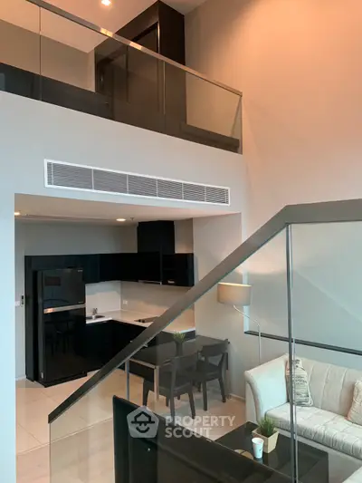 Modern duplex apartment with sleek kitchen and cozy living area