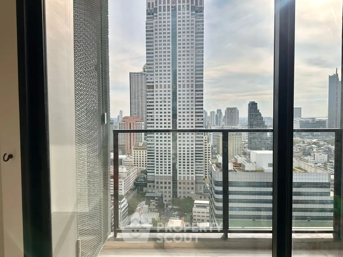 Stunning cityscape view from a modern high-rise balcony, perfect for urban living.