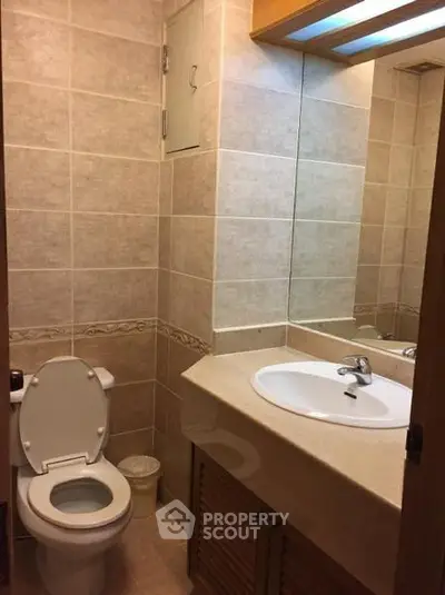 Cozy bathroom with modern fixtures and elegant tile design, perfect for a comfortable living space.