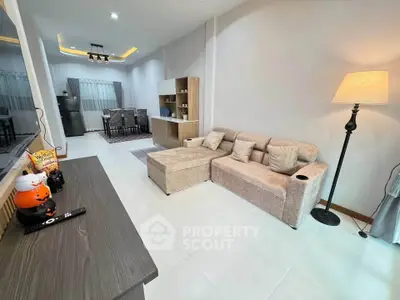 Spacious modern living room with cozy sectional sofa and elegant lighting
