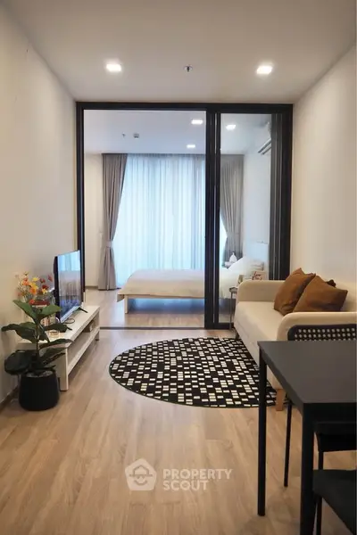 Modern open-plan living room with stylish decor and cozy ambiance