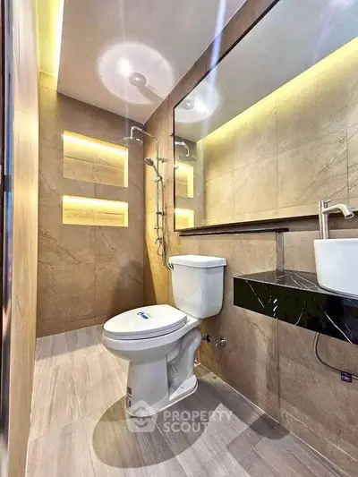 Modern bathroom with sleek fixtures and ambient lighting