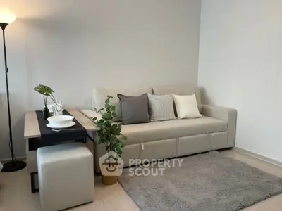 Modern living room with cozy beige sofa and stylish decor