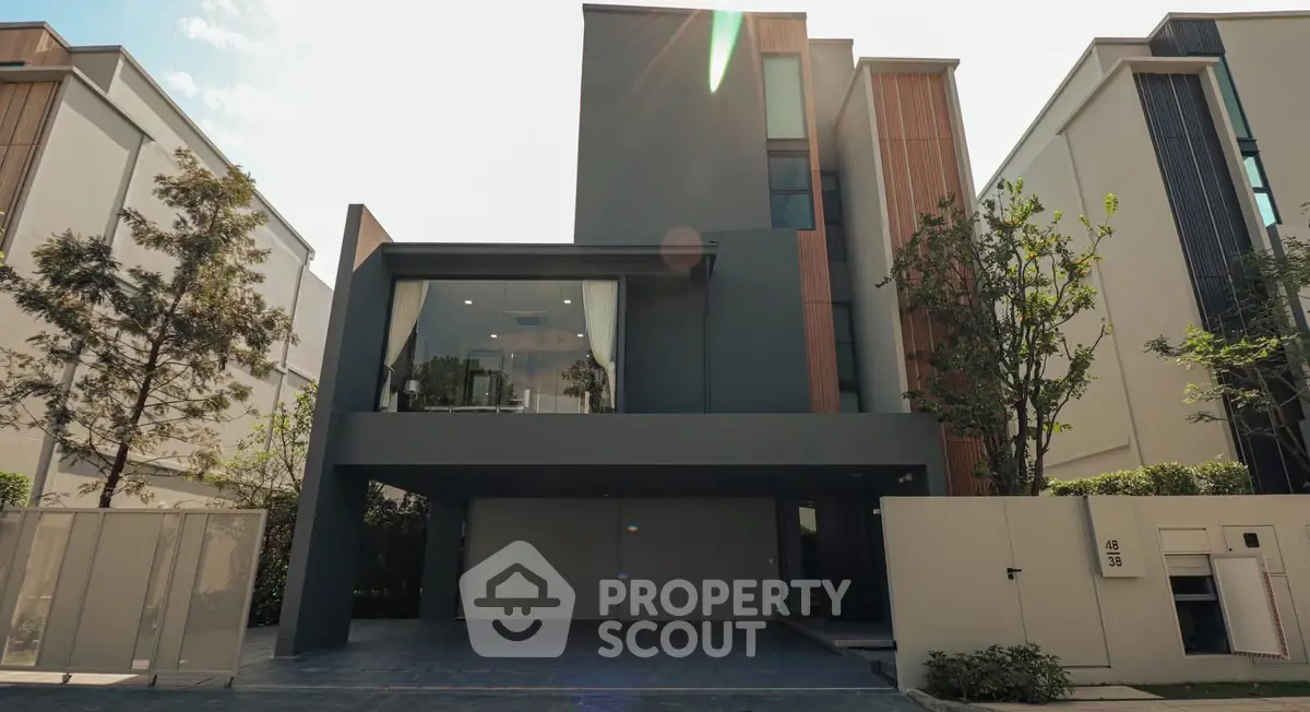 Modern architectural house exterior with sleek design and spacious driveway