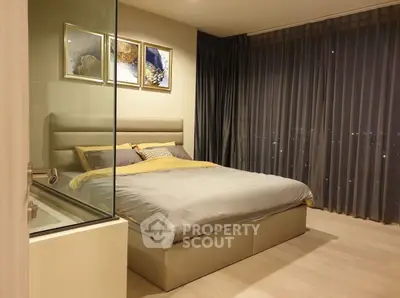 Luxurious bedroom with modern decor and floor-to-ceiling windows offering stunning city views.