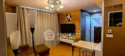 Cozy living room with modern decor and wall-mounted TV, perfect for relaxation and entertainment.