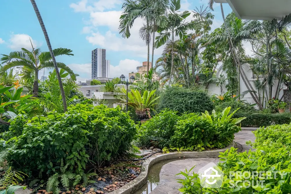 Lush garden view with cityscape backdrop, perfect for urban nature lovers.