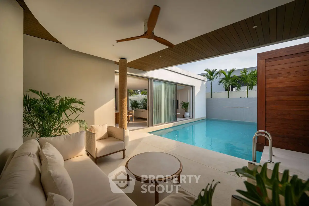 Luxurious poolside lounge with modern design and tropical plants