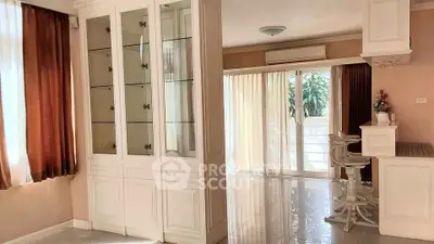 Spacious living area with elegant cabinetry and natural light, perfect for modern living.