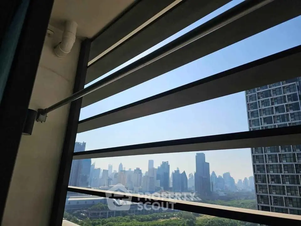 Stunning city skyline view from a modern high-rise balcony, showcasing urban living at its finest.