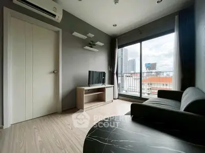 Modern living room with city view and sleek furniture