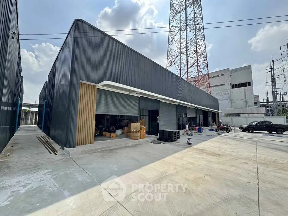 Modern industrial warehouse with spacious exterior and ample parking space