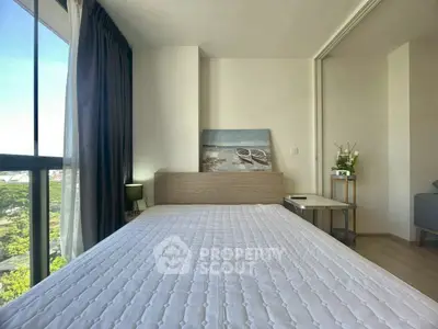 Modern bedroom with large window and minimalist decor