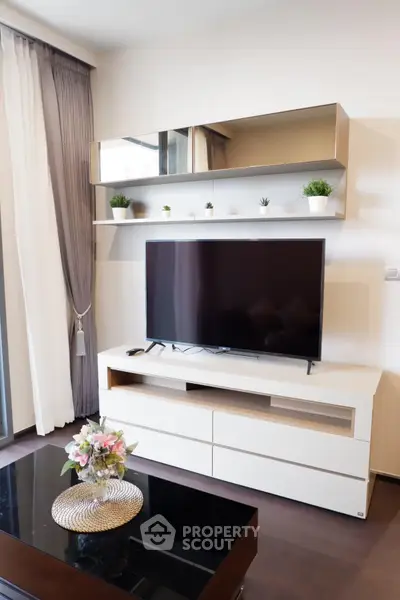 Modern living room with sleek TV unit and stylish decor