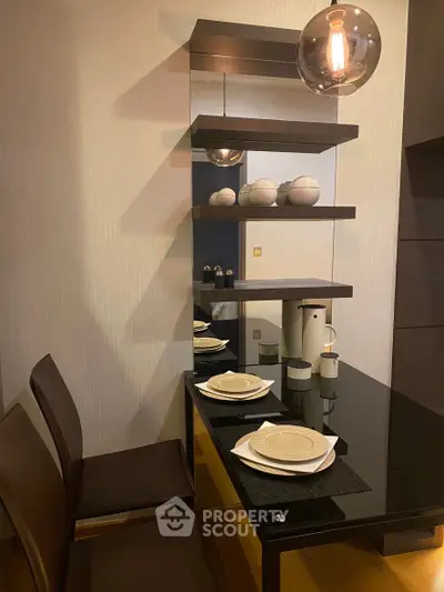 Stylish dining area with modern decor and elegant shelving in a contemporary home.