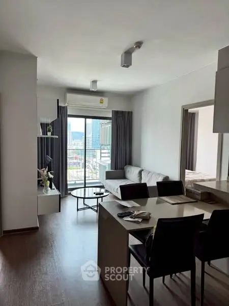 Modern living room with open layout and city view balcony