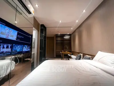 Modern bedroom with stylish decor and cozy ambiance in a luxury apartment.
